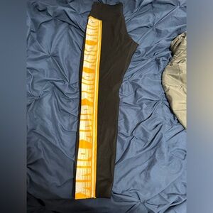 Selling PINK leggings that are black, yellow, and white size large.